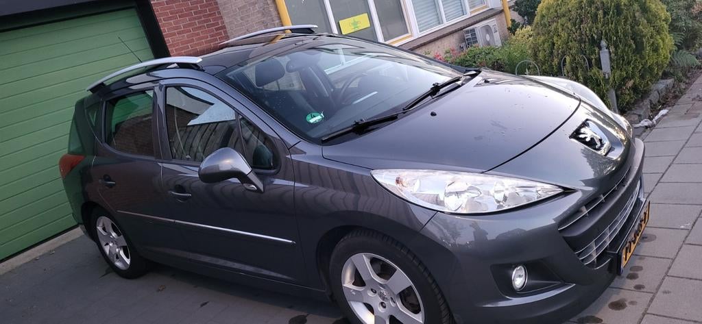 Peugeot 207 1.6 16V SW Outdoor 2011 Grijs Allure/Panoramadak, Auto's, Voorwielaandrijving, Euro 5, Zwart, 4 cilinders
