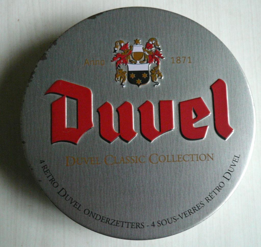 oude doos met 4 onderzetters DUVEL metaal, Ophalen of Verzenden, Zo goed als nieuw, Glas of Glazen, Overige merken