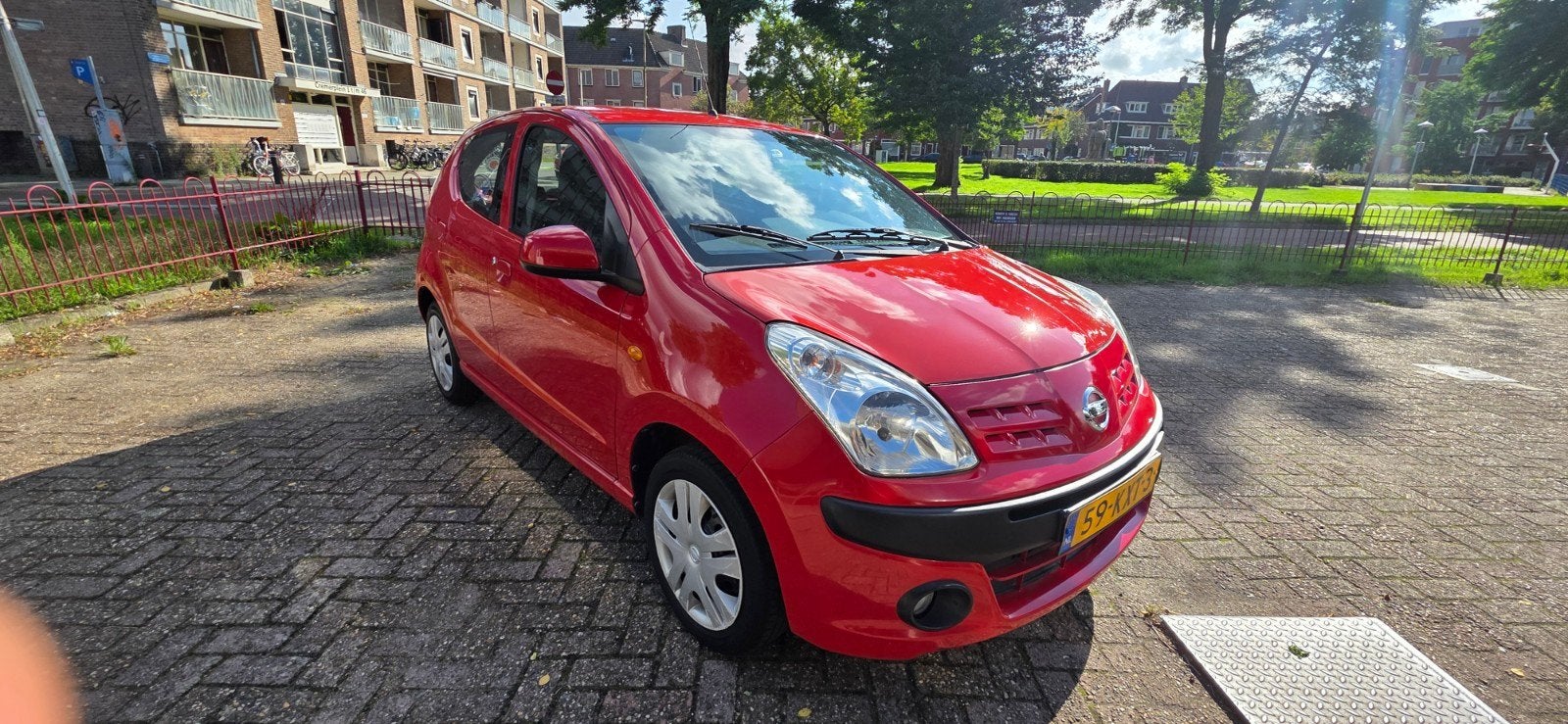 Nissan Pixo 1.0 50KW 5D 2010 Rood, Auto's, Voorwielaandrijving, 200 kg, 4 stoelen, Origineel Nederlands
