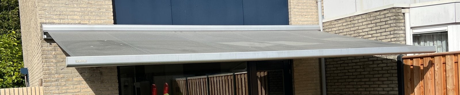 Bustor Knikarm zonnescherm met Somfy motor, Ophalen, 450 cm of meer, Elektrisch, Zo goed als nieuw
