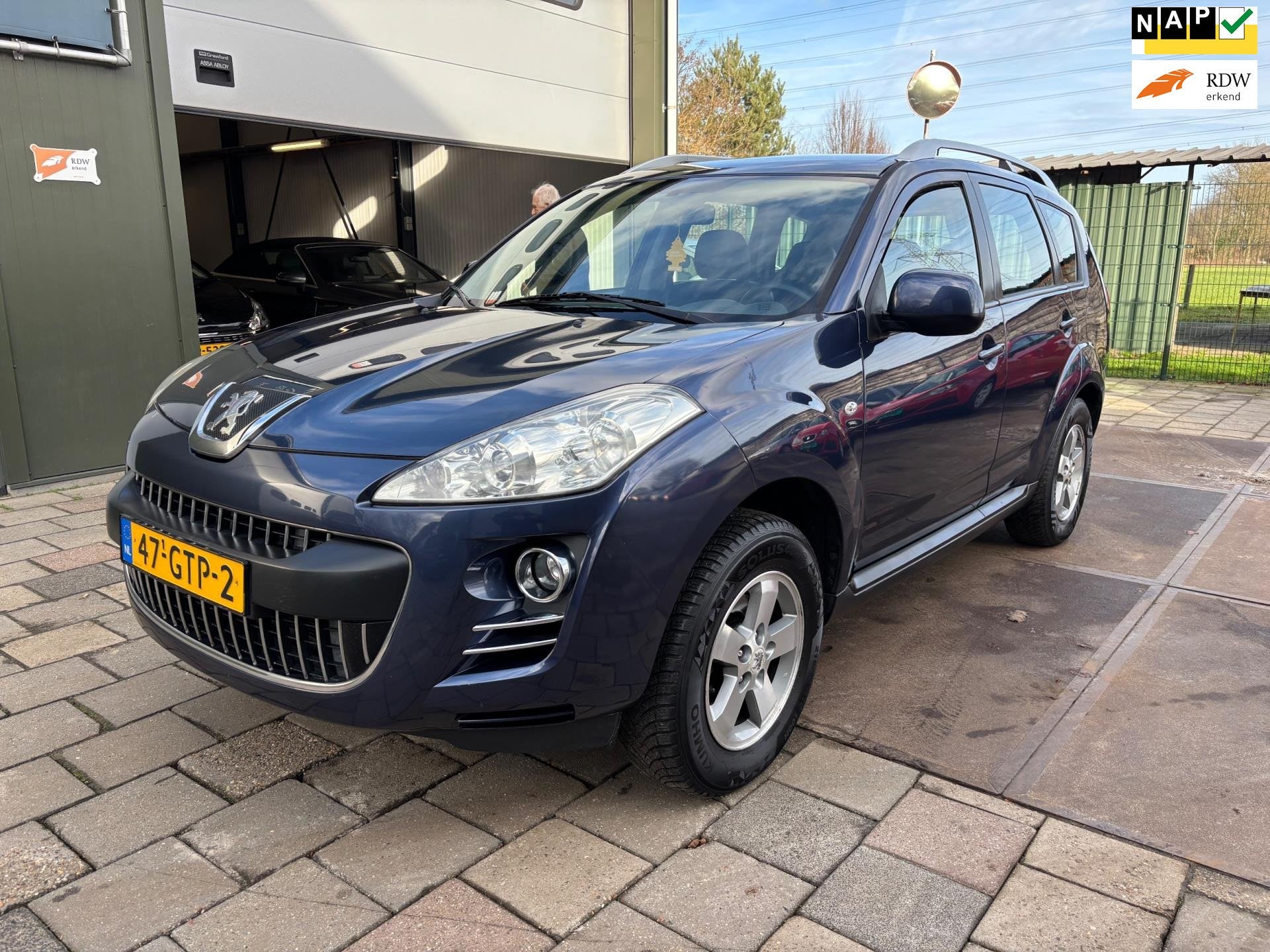 Peugeot 4007 2.4 ST 7p Automaat 4x4, Auto's, Peugeot, Automaat, Gebruikt, Zwart, 4 cilinders
