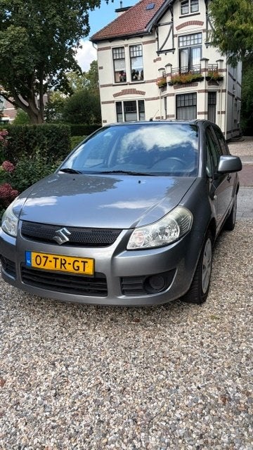 Suzuki SX4 1.6 Comfort Automaat, Auto's, Dealer onderhouden, Stof, Zwart, 4 cilinders