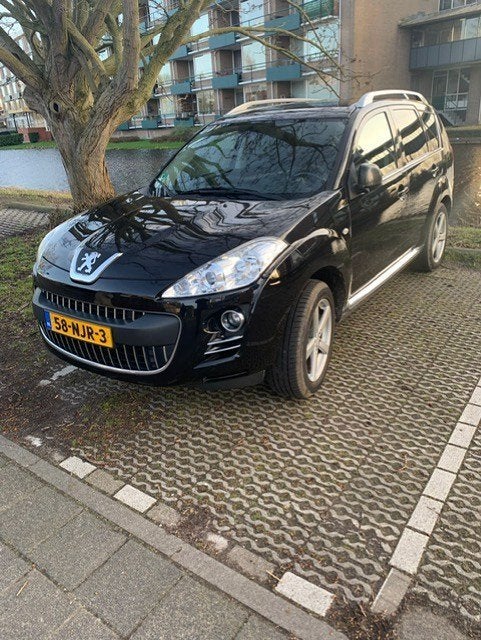 Peugeot 4007 2.4 16V 4WD 7P CVT 2010 Zwart, Auto's, Automaat, Euro 5, Zwart, 4 cilinders