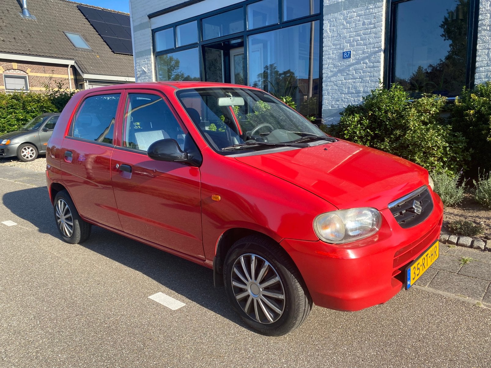 Suzuki Alto 1.1 Spirit Automaat 2005 Rood, Auto's, Suzuki, Stof, 4 cilinders, Origineel Nederlands, Bedrijf