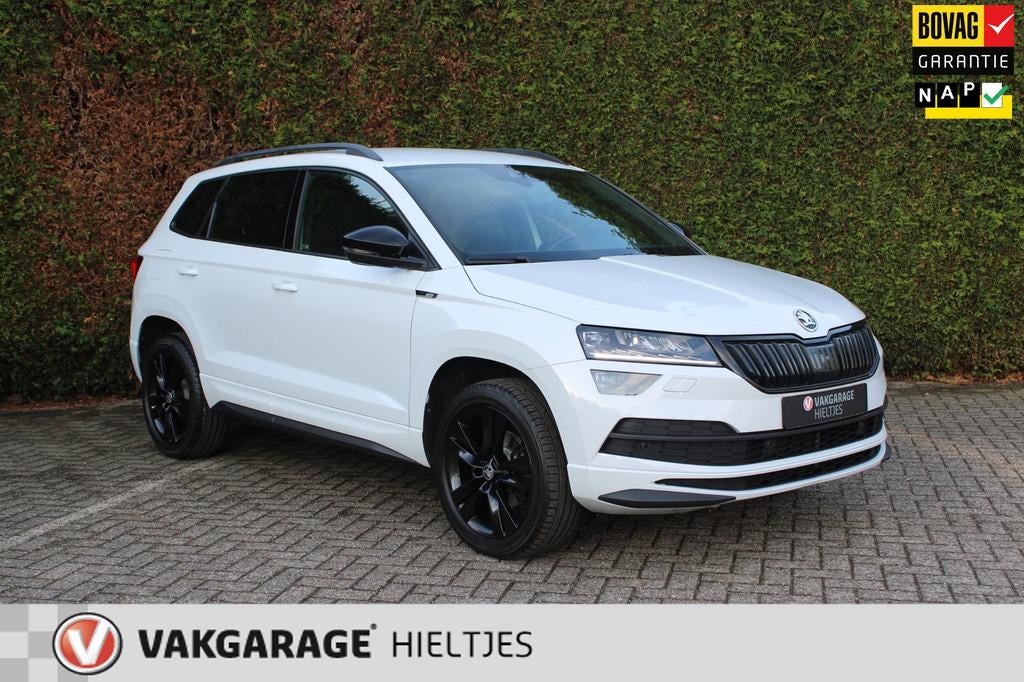 Skoda Karoq 1.5 TSI ACT Sportline Business, Auto's, Skoda, Stof, 4 cilinders, 150 pk, Wit