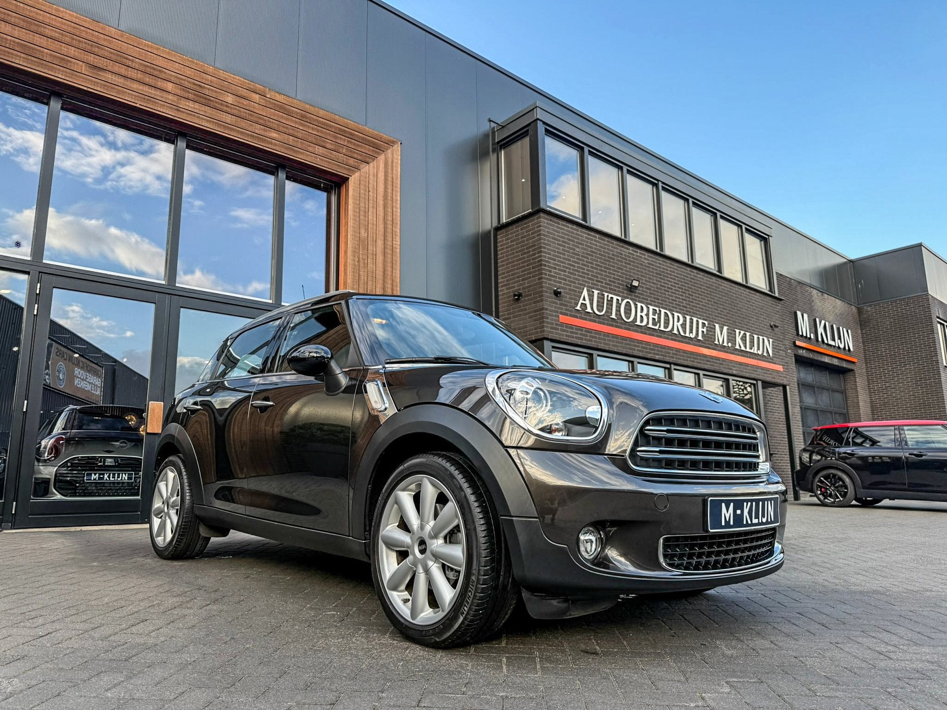 Mini Countryman 1.6 Cooper aut 122pk/Leer/Xenon/Navi/Ned aut, Auto's, Dealer onderhouden, Gebruikt, Bruin, 122 pk