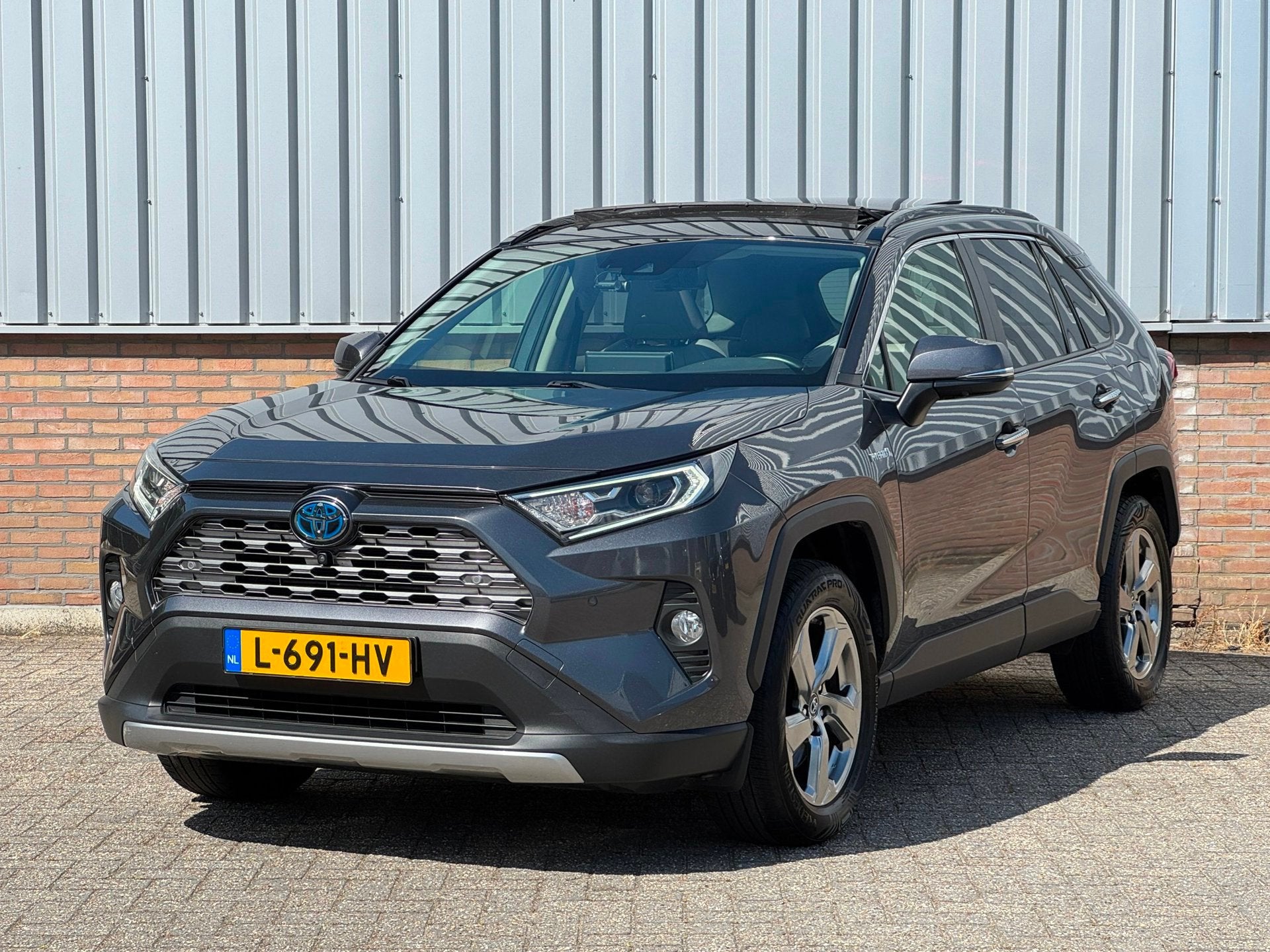 Toyota RAV4 2.5 Hybrid AWD Executive Panorama/ Leder/ Trekha, Auto's, Toyota, Automaat, Gebruikt, Euro 6, 4 cilinders