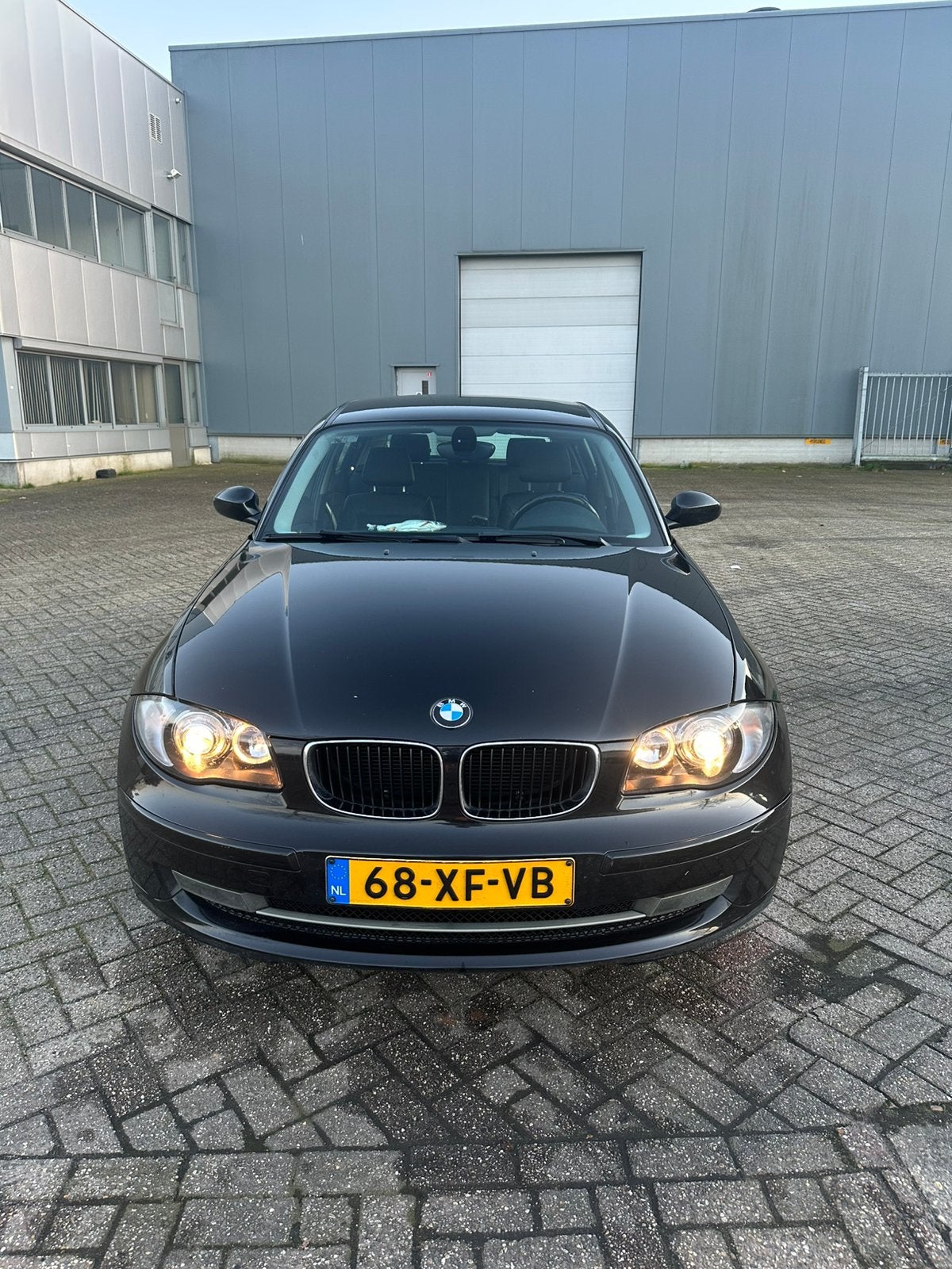 BMW 1-Serie 2.0 118I 5DR 2007 Zwart High Executive, Auto's, BMW, 1-Serie, Achterwielaandrijving, 1995 cc, Zwart
