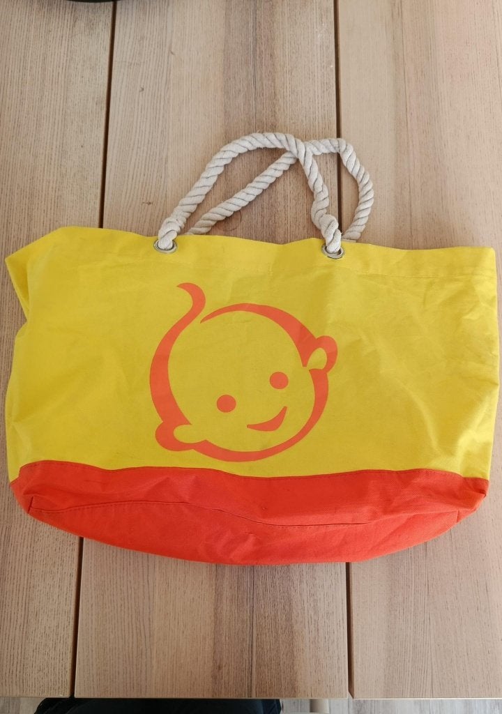 Gele en oranje shopper met babygezichtje, Ophalen of Verzenden, Gebruikt, Geel, Shopper