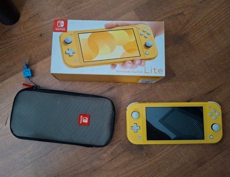 Nintendo Switch Lite Geel - Compleet met hoes, doos, lader, Spelcomputers en Games, Ophalen of Verzenden, Geel, Zo goed als nieuw