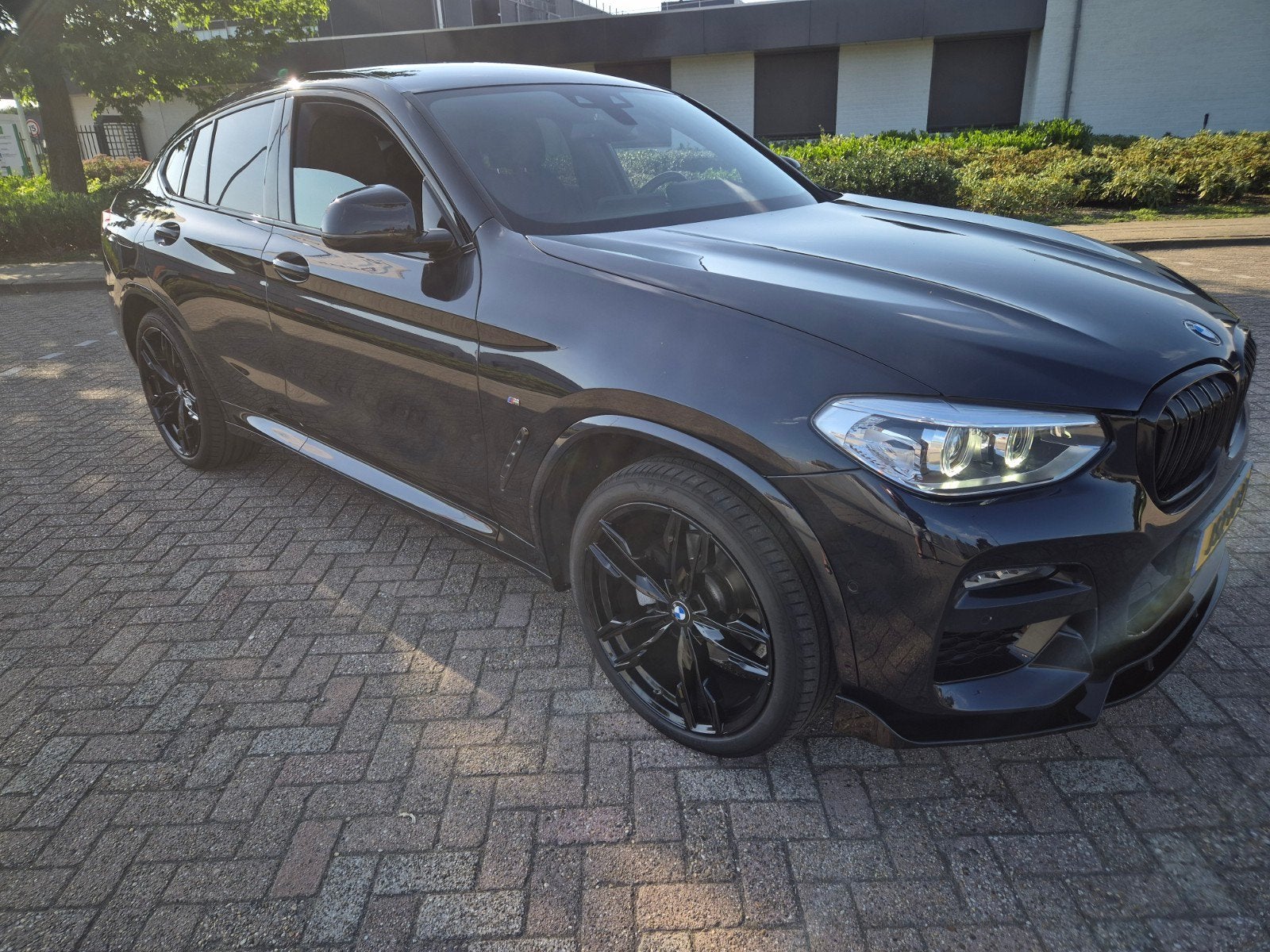 BMW X4 Xdrive20i 184pk M Aut 2020 Zwart, Auto's, BMW, 1998 cc, Zwart, 4 cilinders, 2000 kg