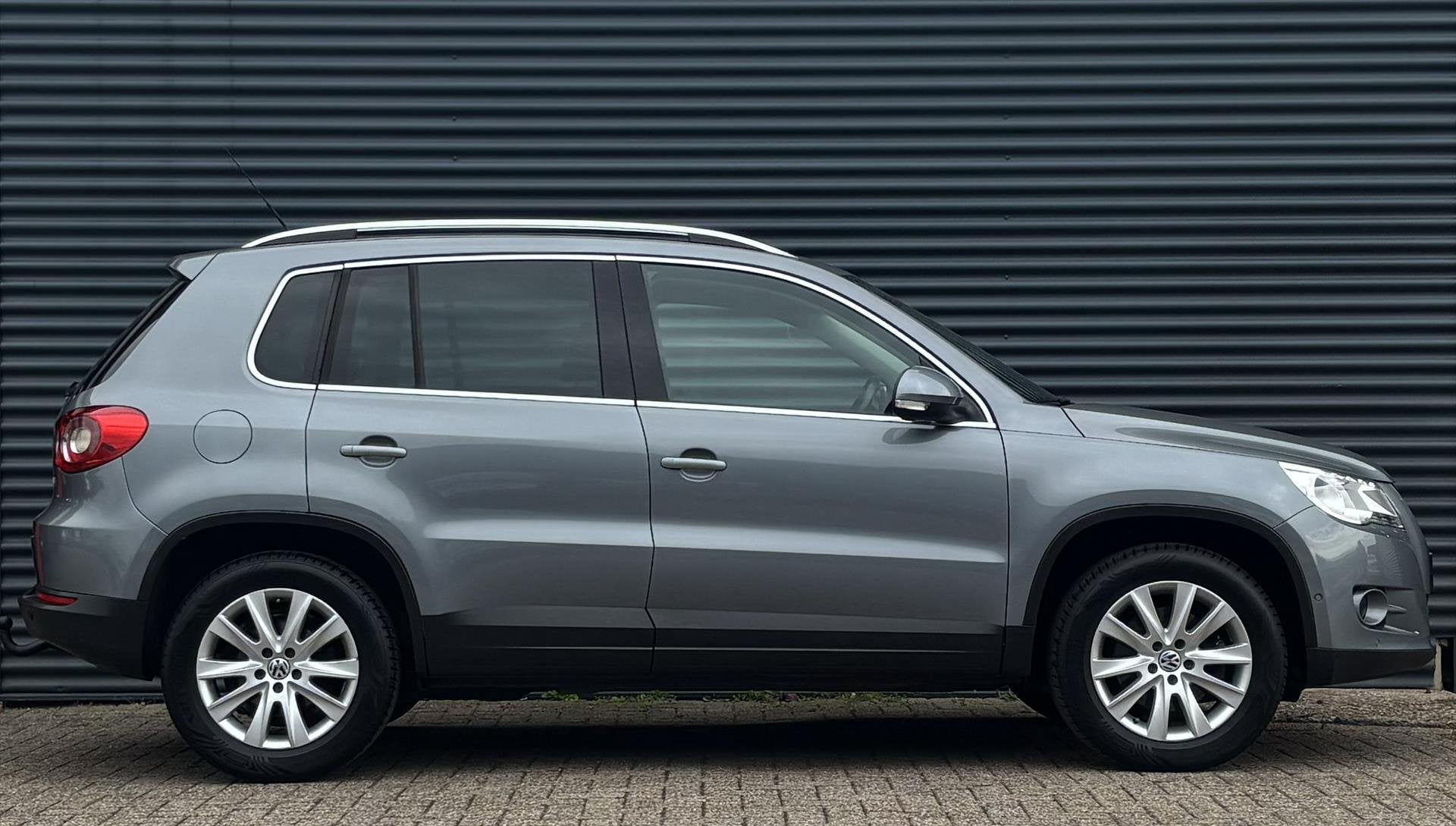 Volkswagen Tiguan 1.4 TSI 150PK 4MOTION, Auto's, Stof, Gebruikt, Zwart, 4 cilinders