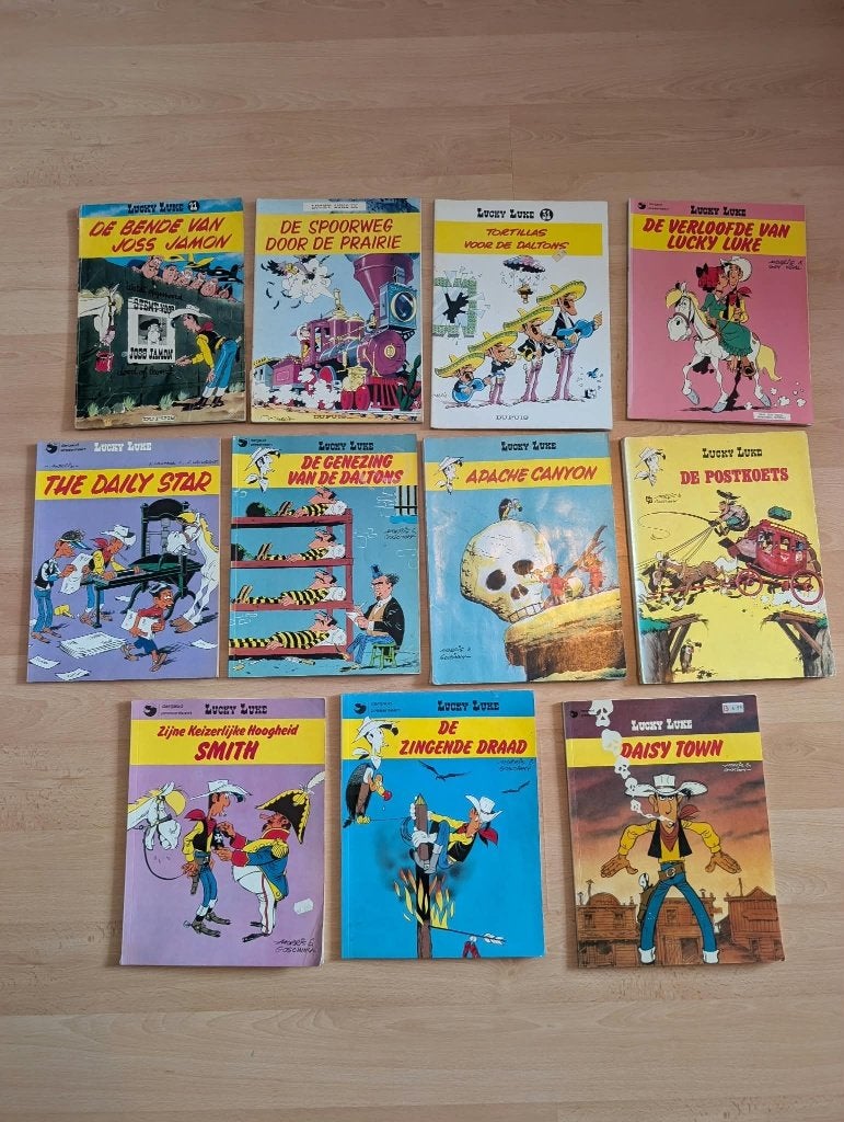 11 stripboeken van Lucky Luke, Meerdere stripboeken, Ophalen of Verzenden, Gelezen