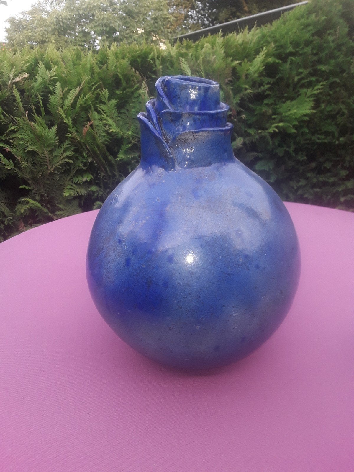 Raku gestookte blauwe vaas, Ophalen
