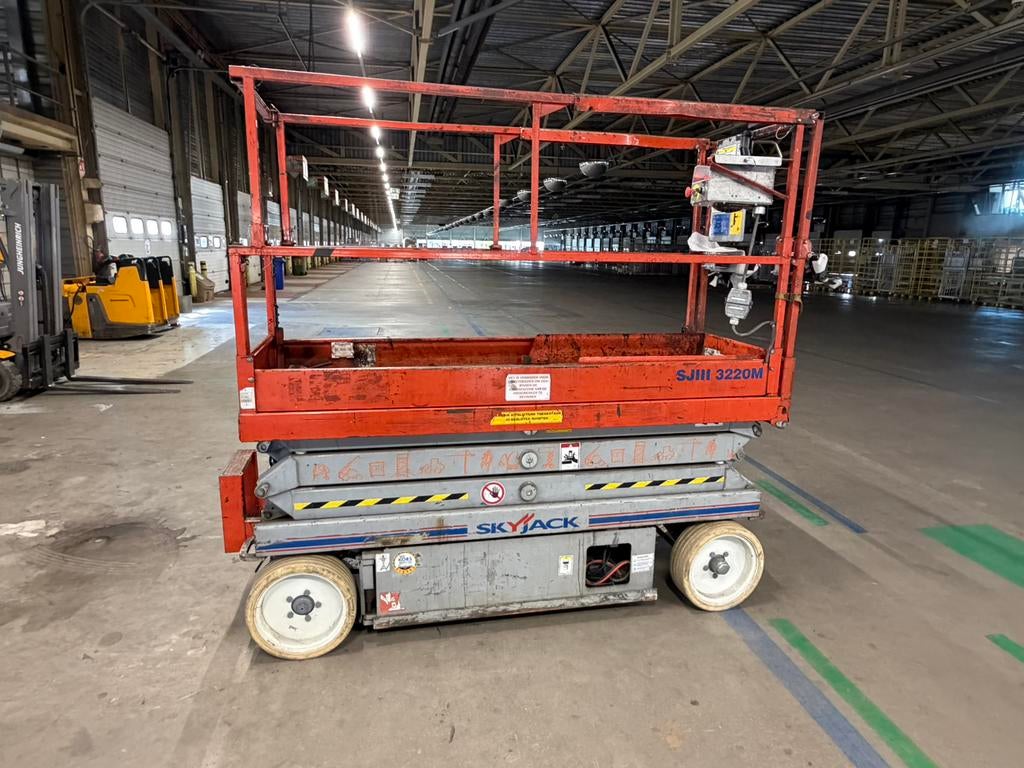 Schaarhoogwerker Skyjack SJ3220M, Zakelijke goederen, Machines en Bouw | Liften, Steigers en Ladders, Ophalen