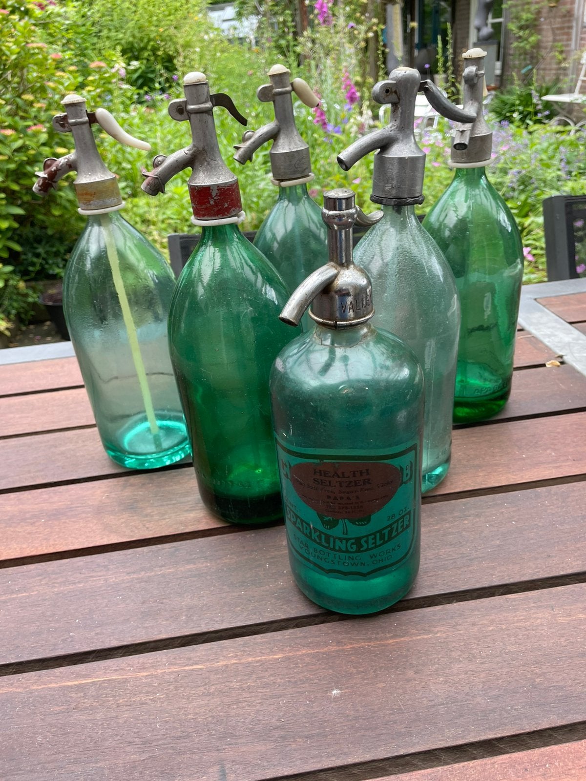 Oude spuitflessen, Ophalen
