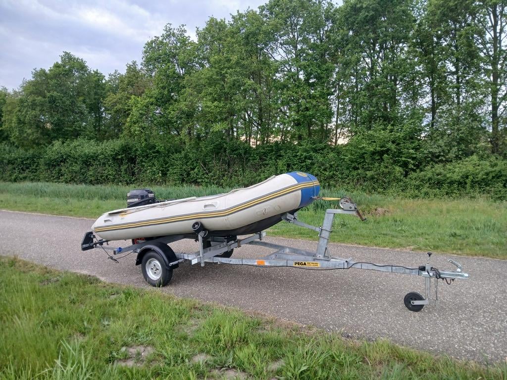 Rubberboot met 6pk buitenboordmotor + trailer, Ophalen, Gebruikt