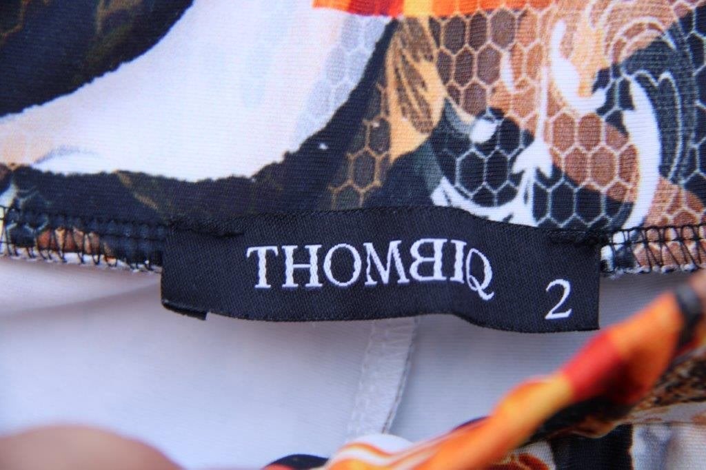 Tregging zwart/ oranje ThombiQ mt 2 (L) Vaste prijs, ThombiQ, Zwart, Maat 42/44 (L), Ophalen of Verzenden