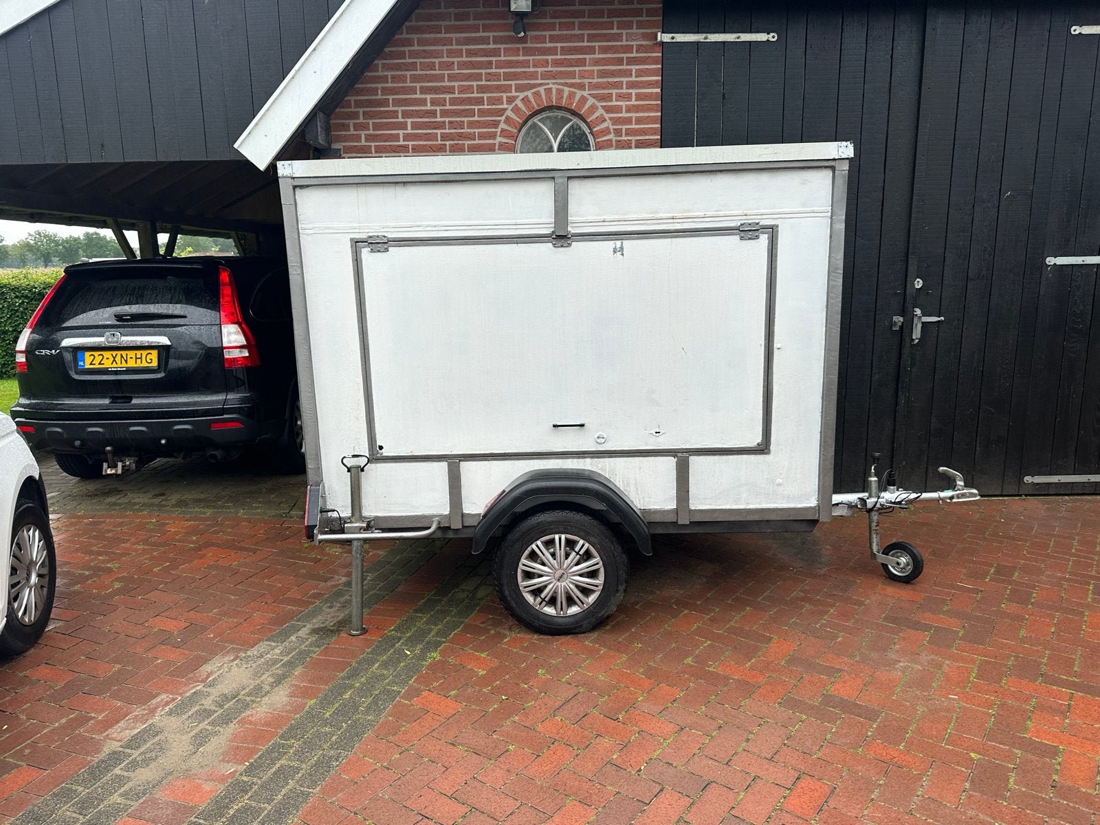 Compacte crossaanhanger, Ophalen, Gebruikt