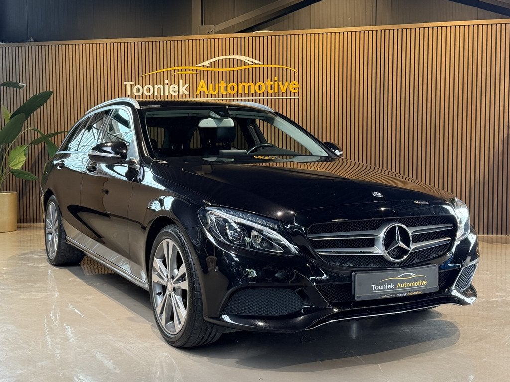 Mercedes-Benz C-Klasse Estate 180 Prestige Navigatie Half le, Auto's, Mercedes-Benz, Achterwielaandrijving, Gebruikt, Leder en Stof