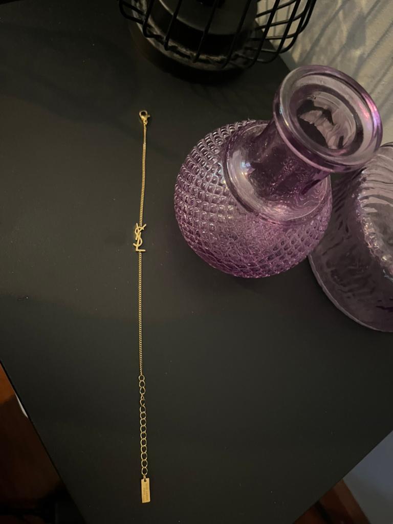 Ysl goudkleurig logo armbandje yves saint laurent, Verzenden, Nieuw, Goud, Staal