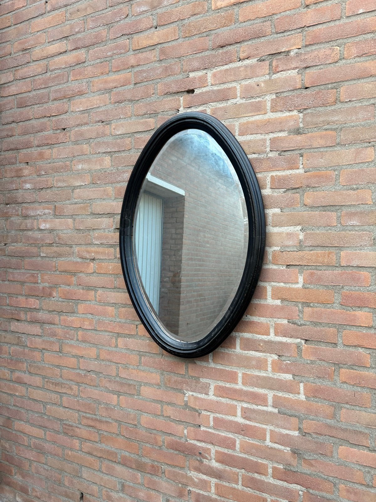 Ovale spiegel met zwarte lijst, Antiek en Kunst, Ophalen, Ovaal, 50 tot 100 cm