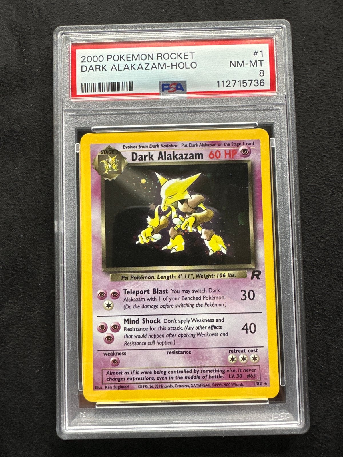 Dark Alakazam 1/82 PSA 8 Holo Pokemon Rocket, Ophalen of Verzenden, Zo goed als nieuw, Losse kaart, Foil