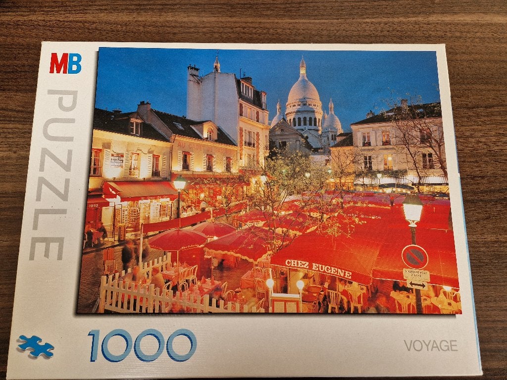 MB puzzel het tertre plein uit de serie voyage, Ophalen of Verzenden, 500 t/m 1500 stukjes, Zo goed als nieuw, Legpuzzel