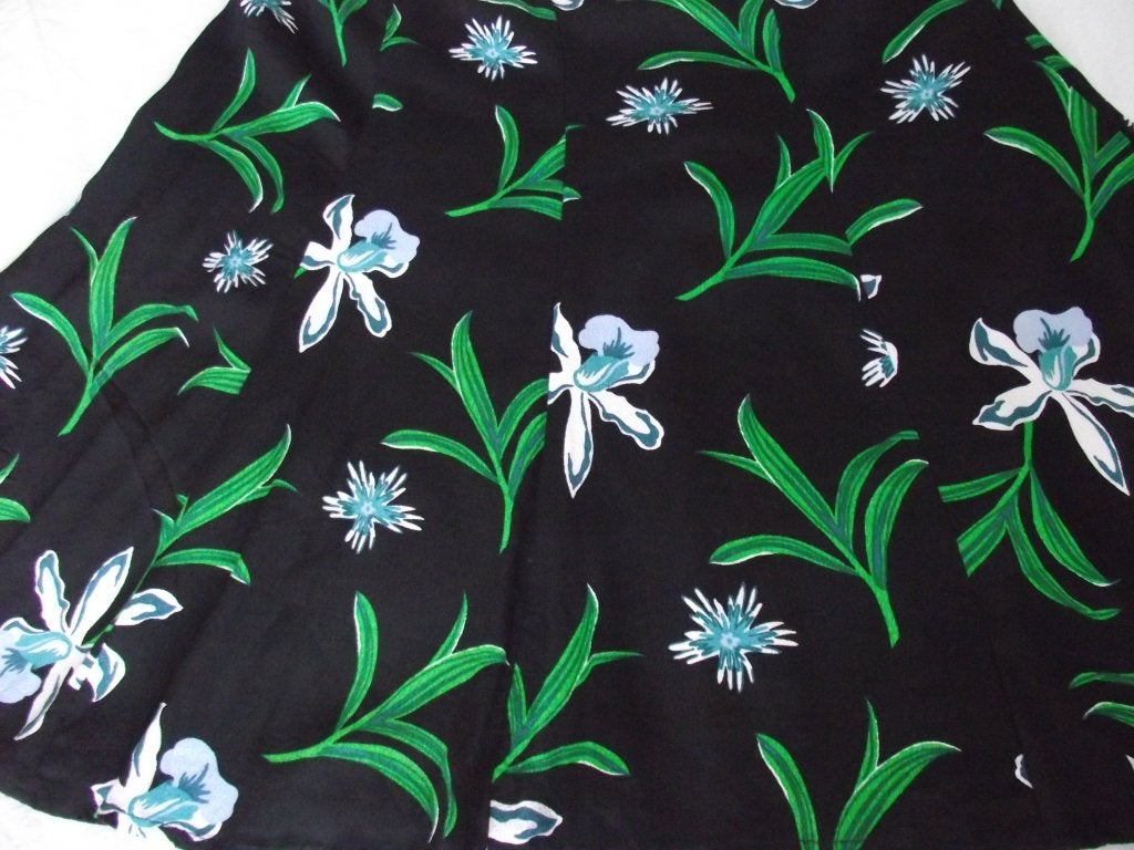zwart tricot turquoise groen lelies bloemen rok Hema M 38-40, Maat 38/40 (M), Zwart, Ophalen of Verzenden, Knielengte