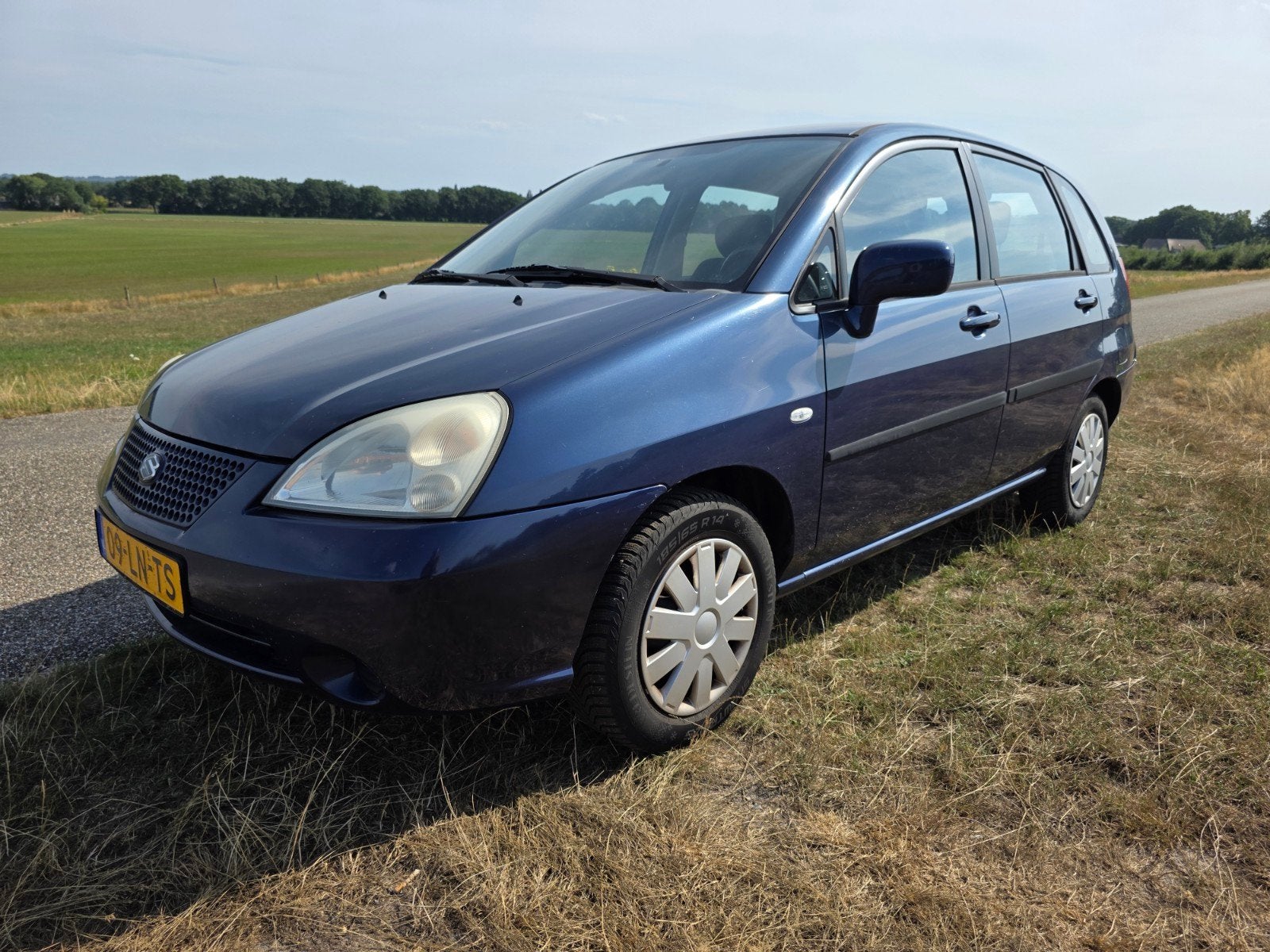 Suzuki Liana GLX 1.6 2003 Blauw Airco, Cruise, CV, Trekhaak, Voorwielaandrijving, Stof, 4 cilinders, Metallic lak