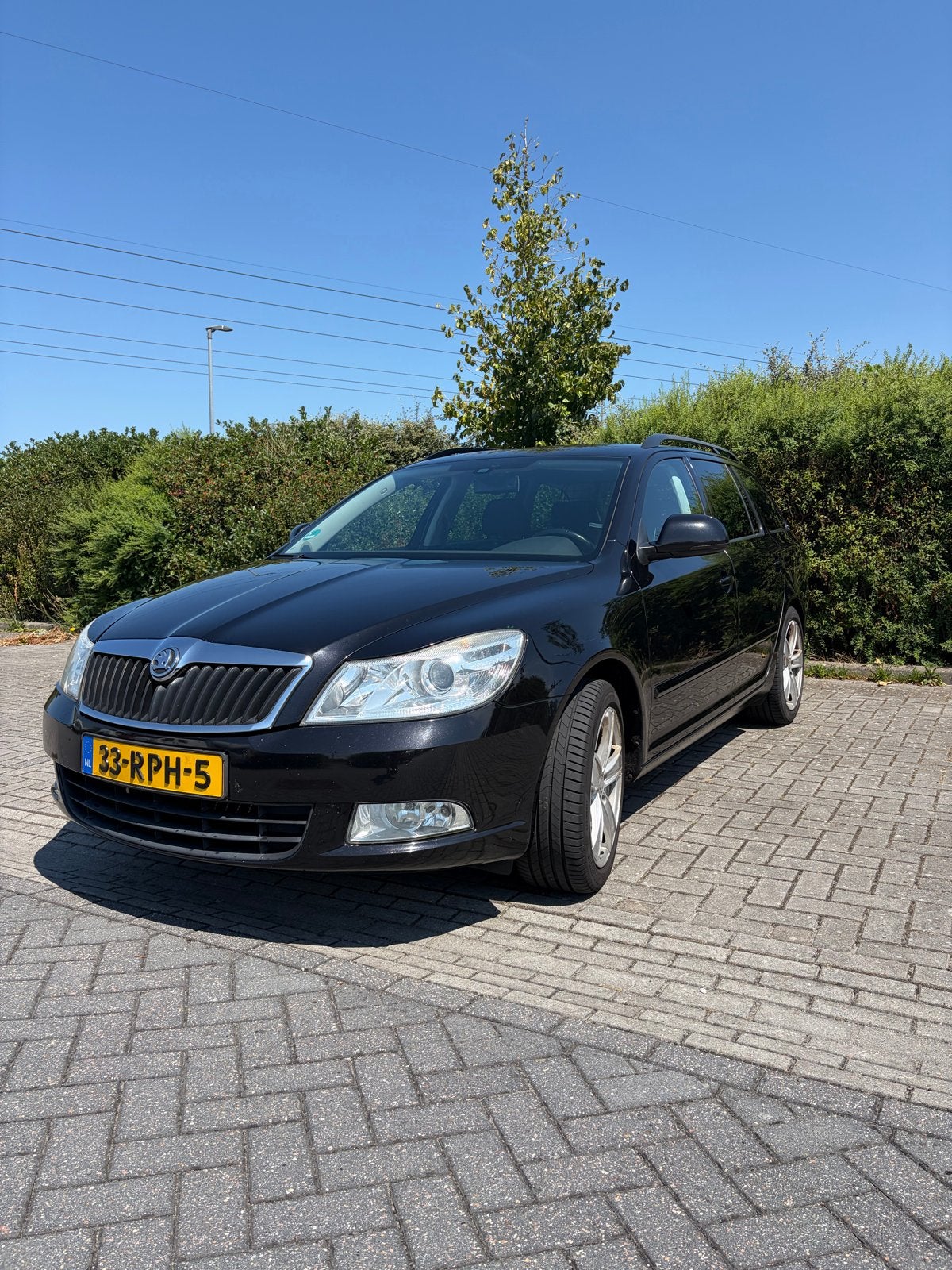 Skoda Octavia 1.2 TSI Combi 2011 Zwart, Auto's, Voorwielaandrijving, Zwart, 4 cilinders, Zwart