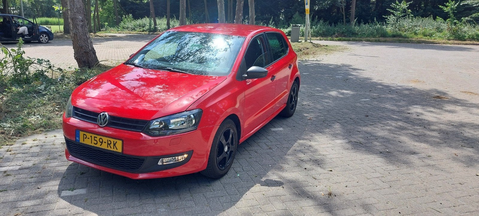 Volkswagen Polo 1.2 51KW 2010 Rood, Auto's, Voorwielaandrijving, 40 €/maand, 1198 cc, Handgeschakeld