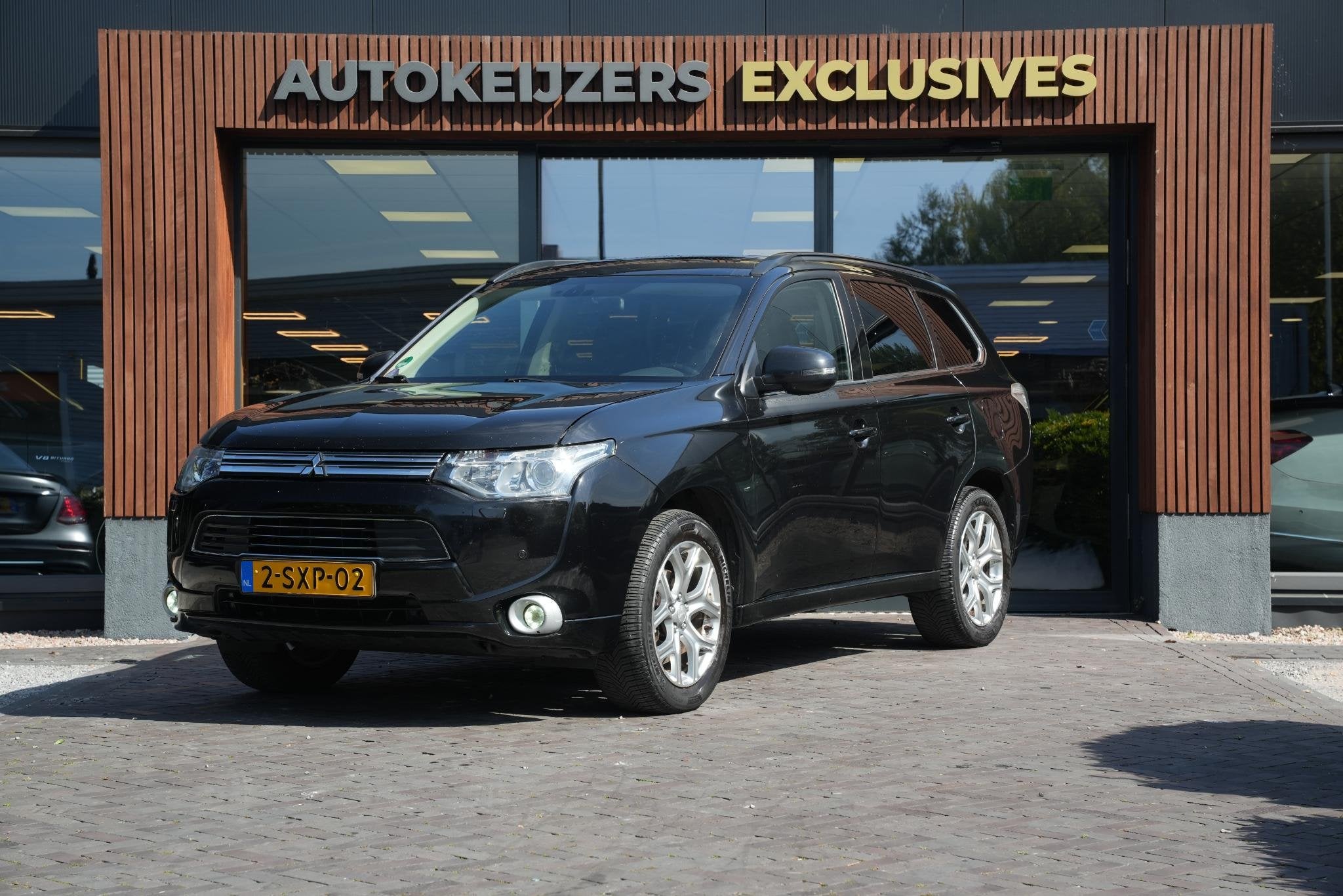 Mitsubishi Outlander 2.0 PHEV instyle Navi Leer PDC Clima St, Auto's, Mitsubishi, 1998 cc, Euro 6, 4 cilinders, Zwart