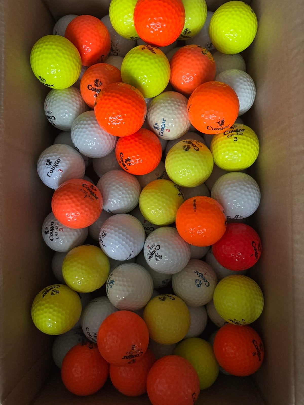 77 stuks golfballen Cougar, Ophalen of Verzenden, Gebruikt
