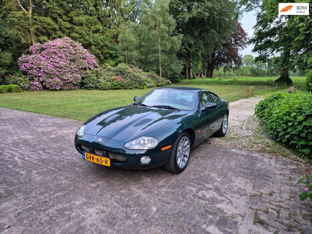Jaguar XKR 4.0 V8 Coupé - British Racing Green - Lage KM -, Auto's, Jaguar, Achterwielaandrijving, Gebruikt, 4 stoelen, Leder