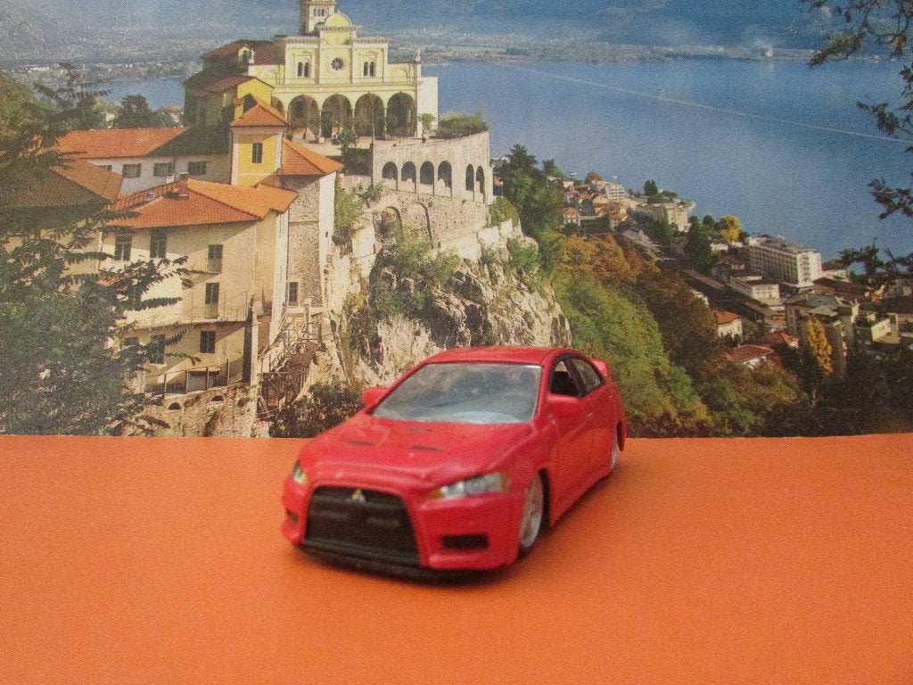 MITSUBISHI LANCER EVOLUTION, Bburago, Ophalen of Verzenden, Zo goed als nieuw, Auto, Overige merken