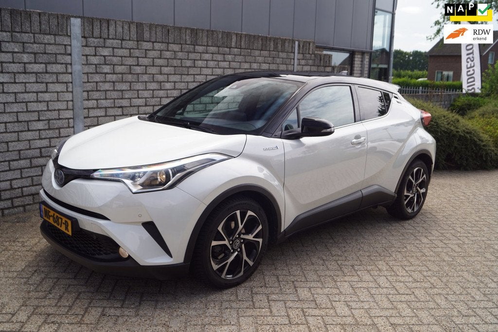 Toyota C-HR 1.8 Hybrid Bi-Tone Autom Navi Camera Clima Adapt, Auto's, Toyota, Stof, 4 cilinders, Wit, Hybride Elektrisch/Benzine
