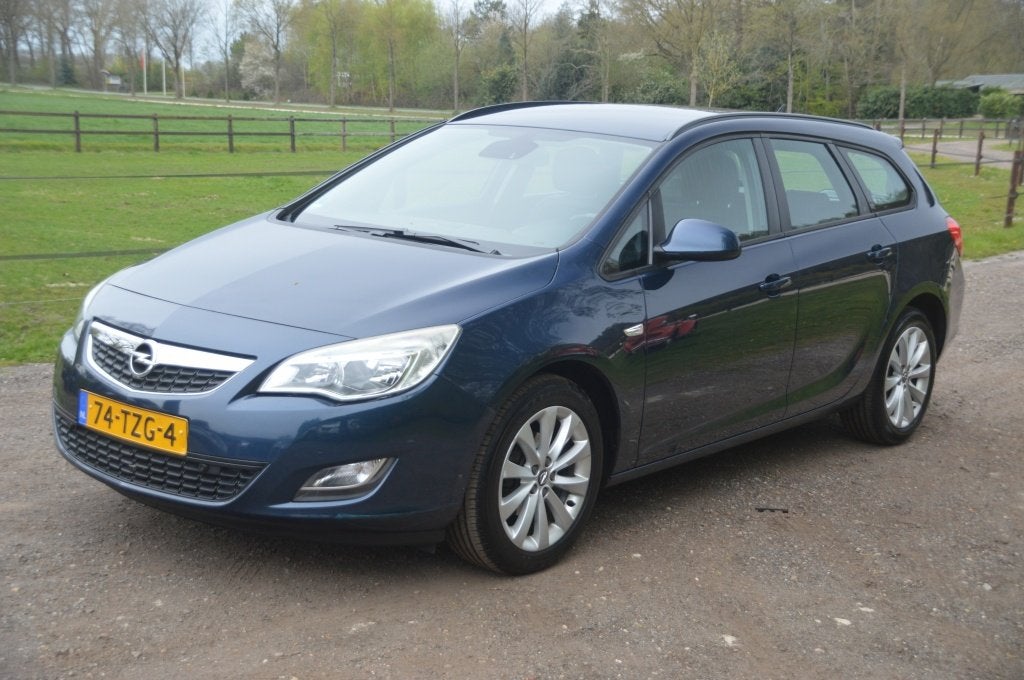 Opel Astra Sports Tourer 1.4 Turbo Clima Cruise Navi PDC, Auto's, Voorwielaandrijving, Euro 5, 4 cilinders, Blauw