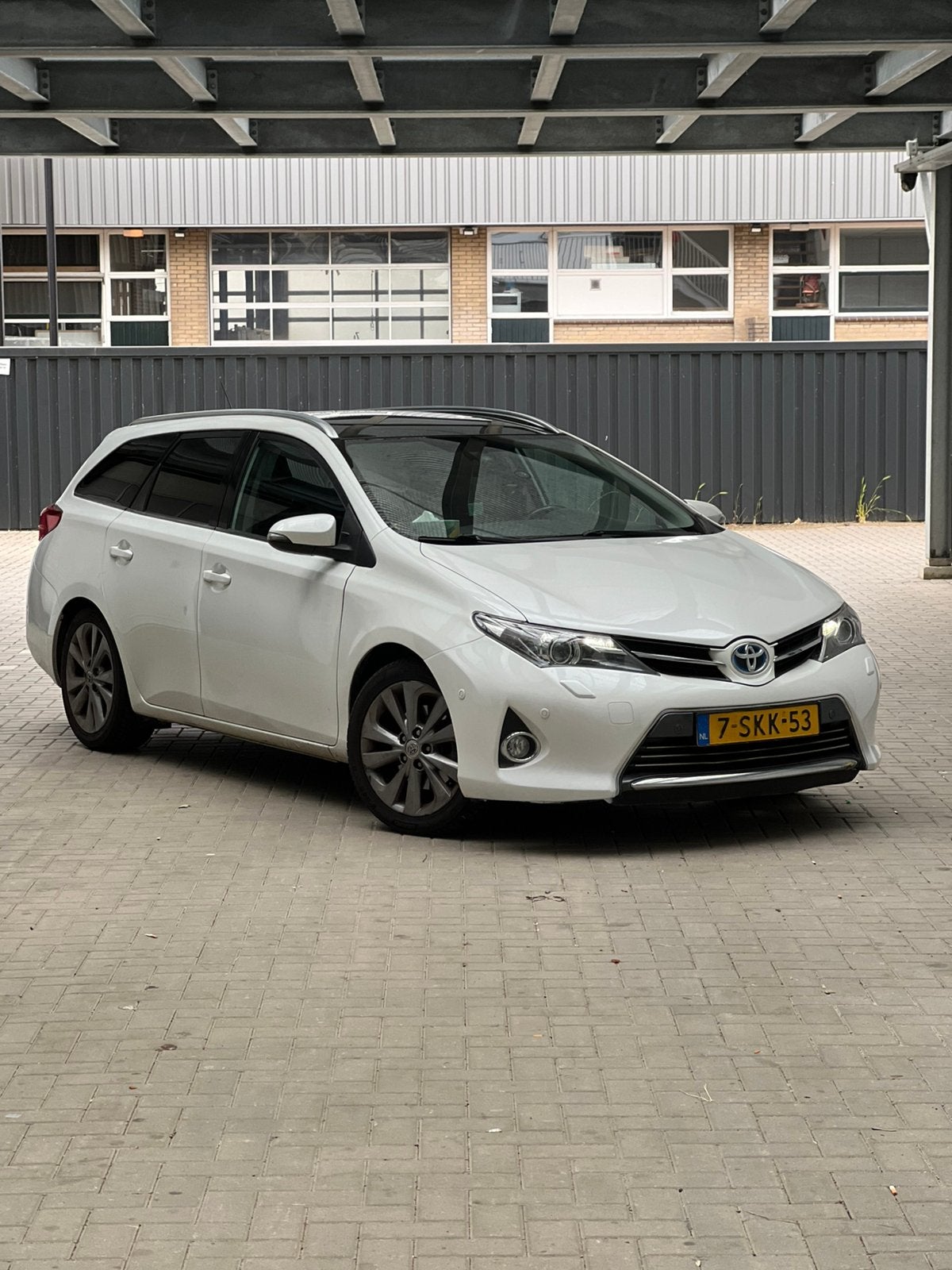 Toyota Auris 1.8 Hybrid Touring Sports CVT 2013 Wit, Auto's, Nissan, 4 cilinders, Leder en Stof, Wit, Origineel Nederlands