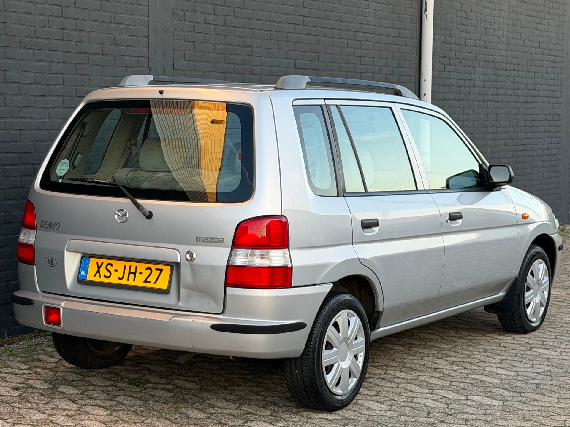 Mazda Demio 1.3 LX APK NAP, 31 €/maand, Bedrijf, Zilver of Grijs, 1324 cc