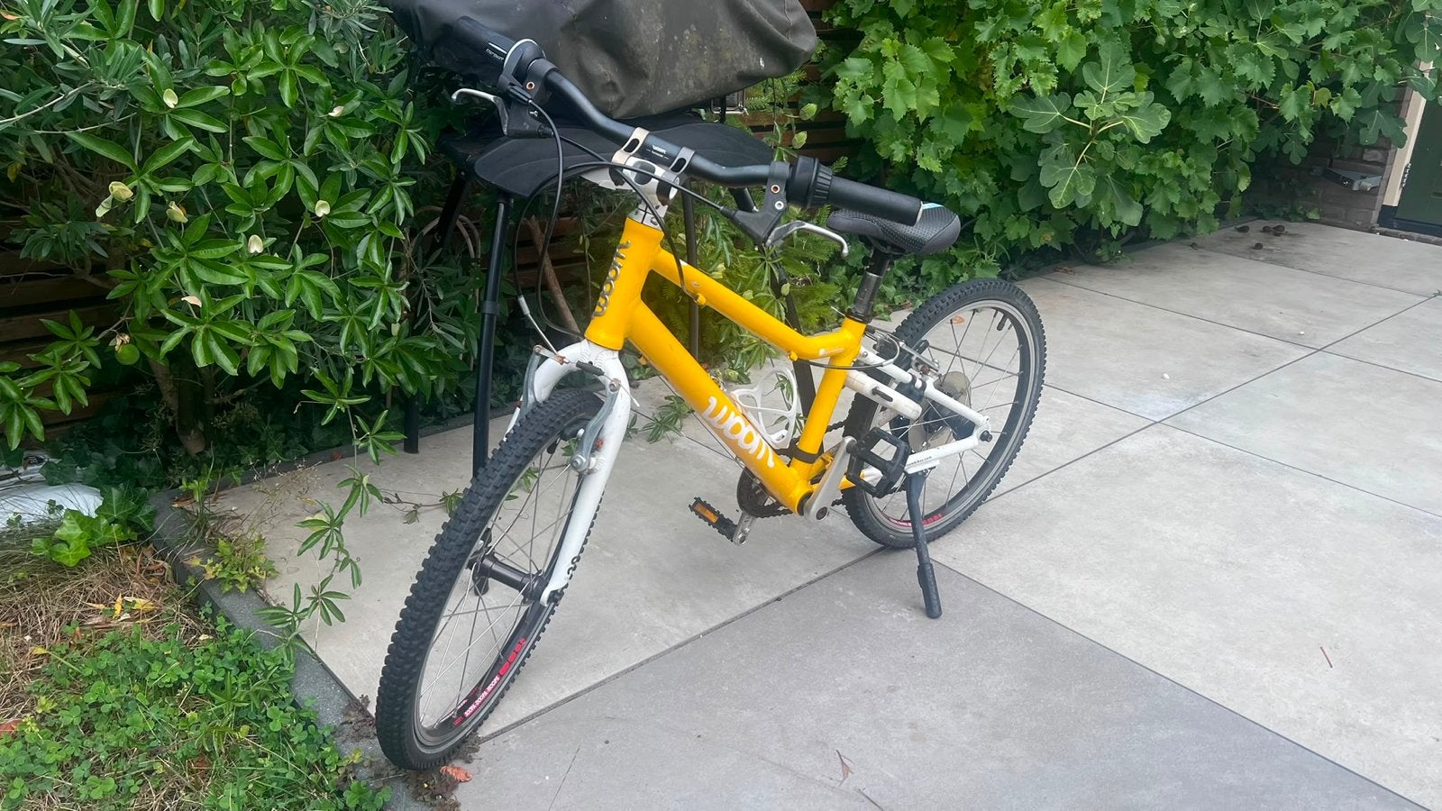 Woom 4 kinderfiets - Geel - 20 inch, Fietsen en Brommers, Fietsen | Kinderfietsjes, Ophalen of Verzenden, Zo goed als nieuw, Velgrem