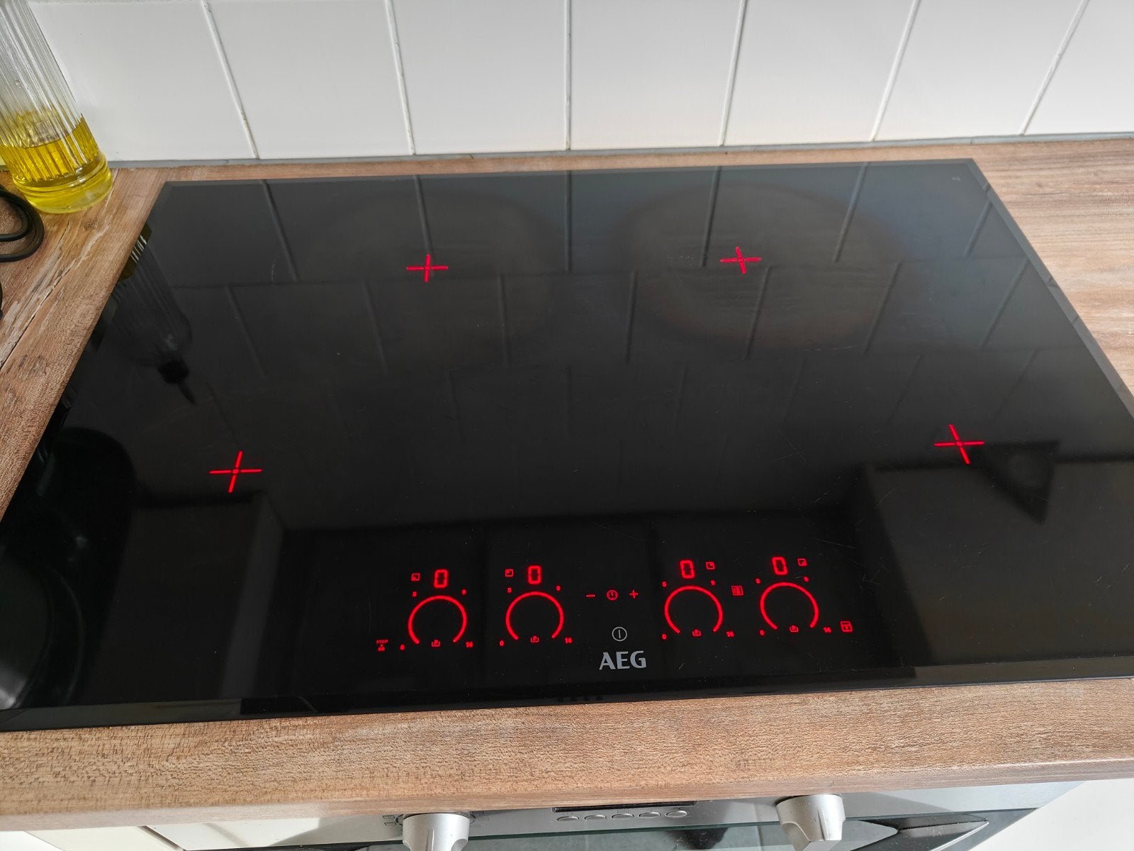 AEG Inductiekookplaat 4 pits 78x52 cm met facetrand, Witgoed en Apparatuur, Kookplaten, Ophalen, Gebruikt, 4 kookzones, Inbouw