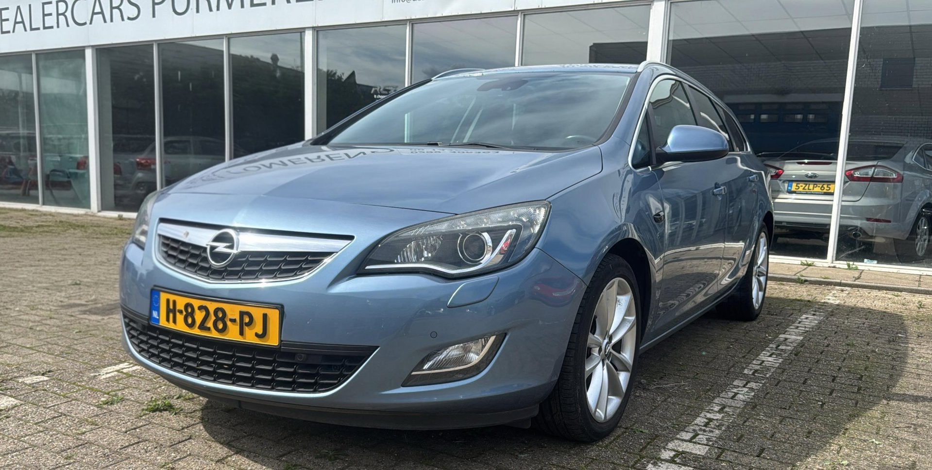 Opel Astra Sports Tourer 1.4 Turbo Sport, Voorwielaandrijving, Euro 5, Stof, Gebruikt