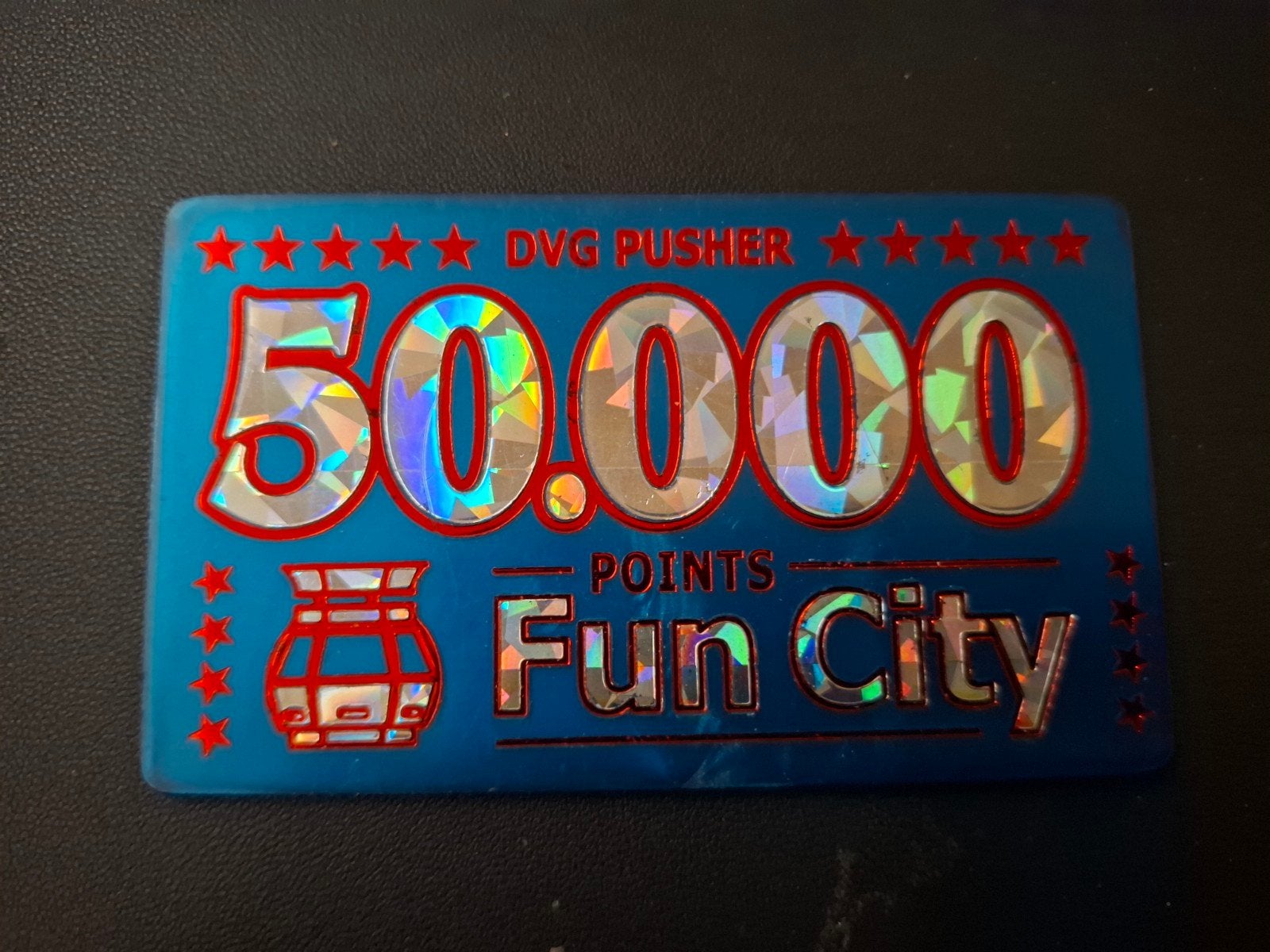 50.000 dvg, coin pusher kermis penning, Ophalen of Verzenden, Overige materialen