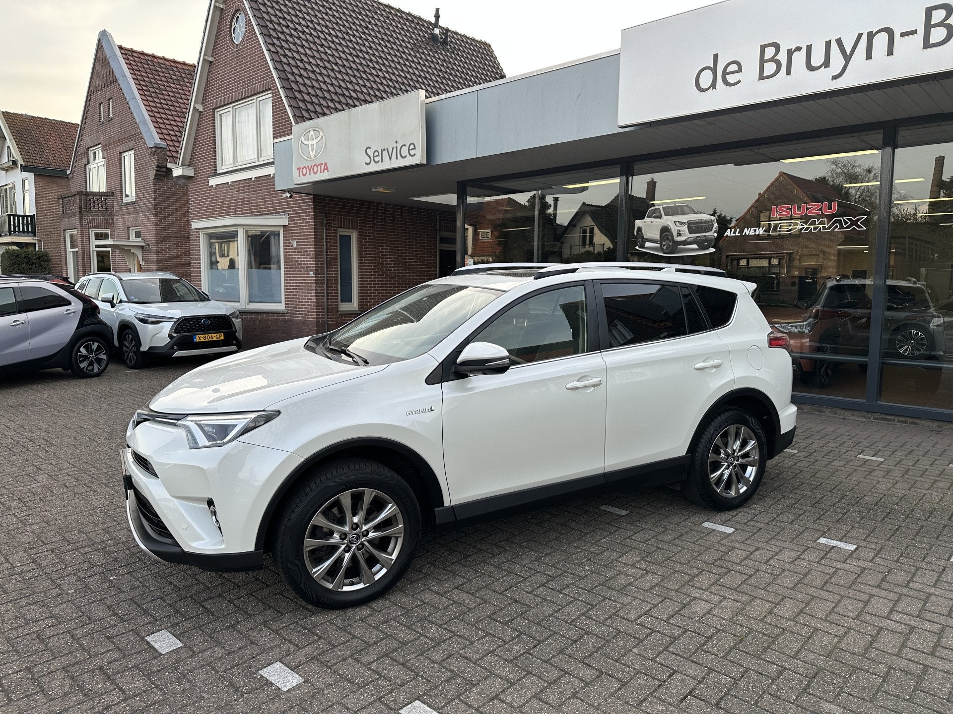 Toyota RAV4 2.5 Hybrid AWD Executive Business trekhaak / sch, Auto's, 12 maanden, Gebruikt, 1650 kg, Wit