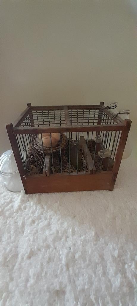 Decoratieve vogelkooi met nest en eieren, Ophalen