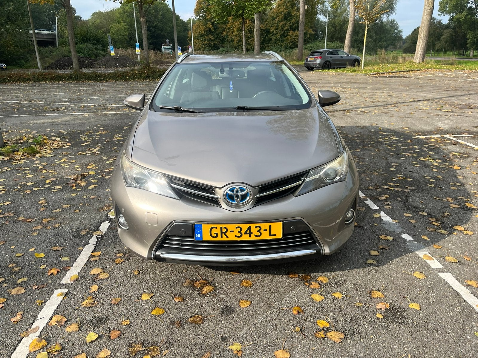 Toyota Auris 1.8 Hybrid Touring Sports CVT 2014 Bruin, Auto's, Dealer onderhouden, Zwart, Bruin, Leder en Stof