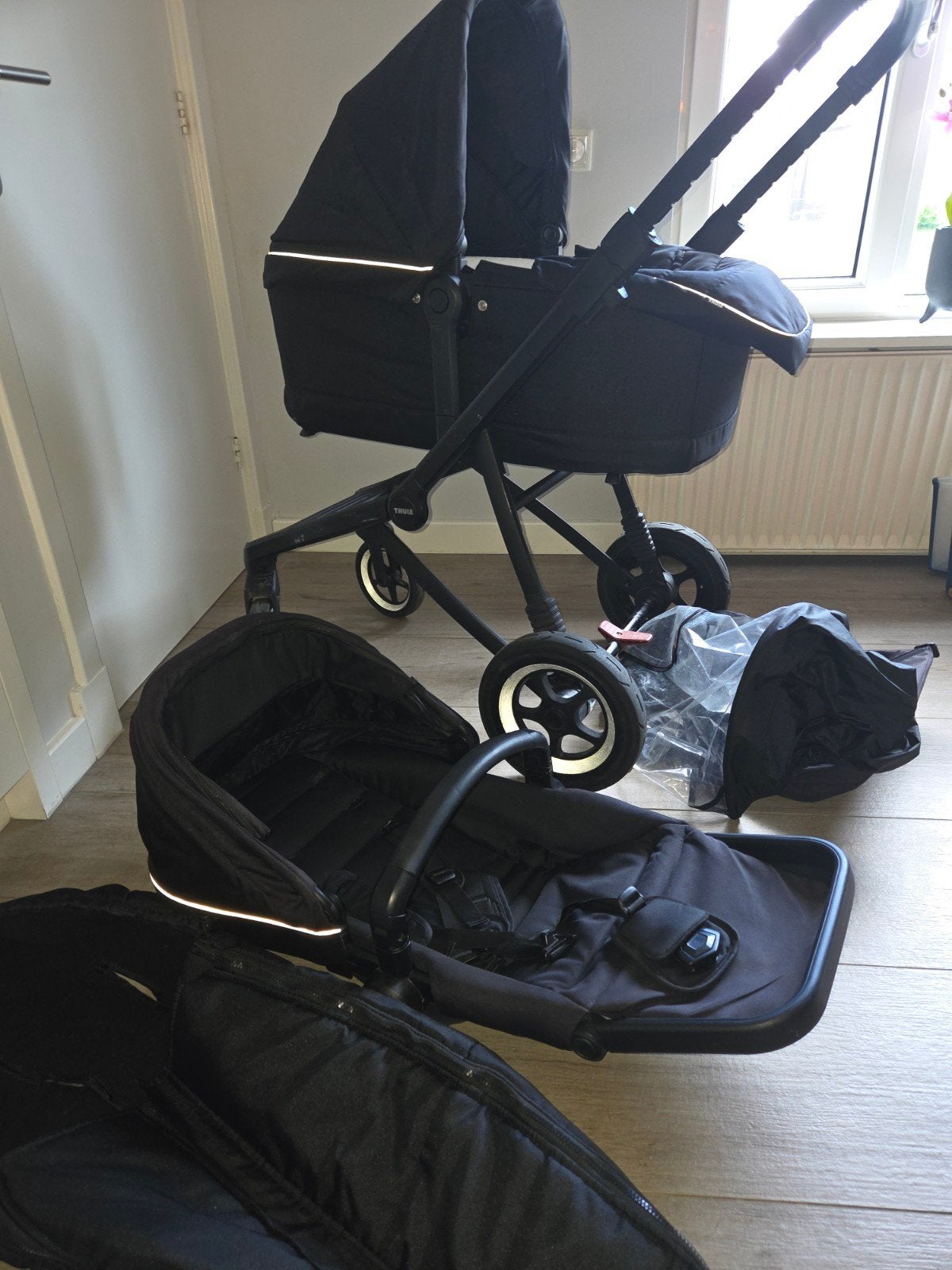 Thule Sleek kinderwagen met voetenzak en regenhoes, Ophalen
