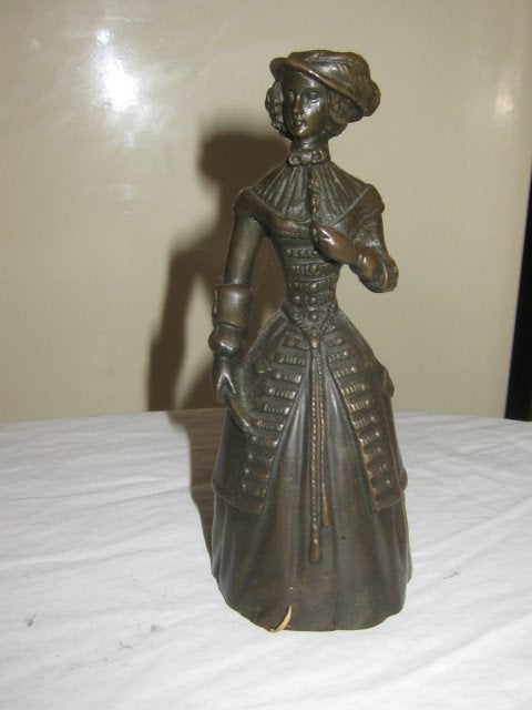 Tafelbel van een elegante vrouw in brons met gietersstempel., Ophalen of Verzenden