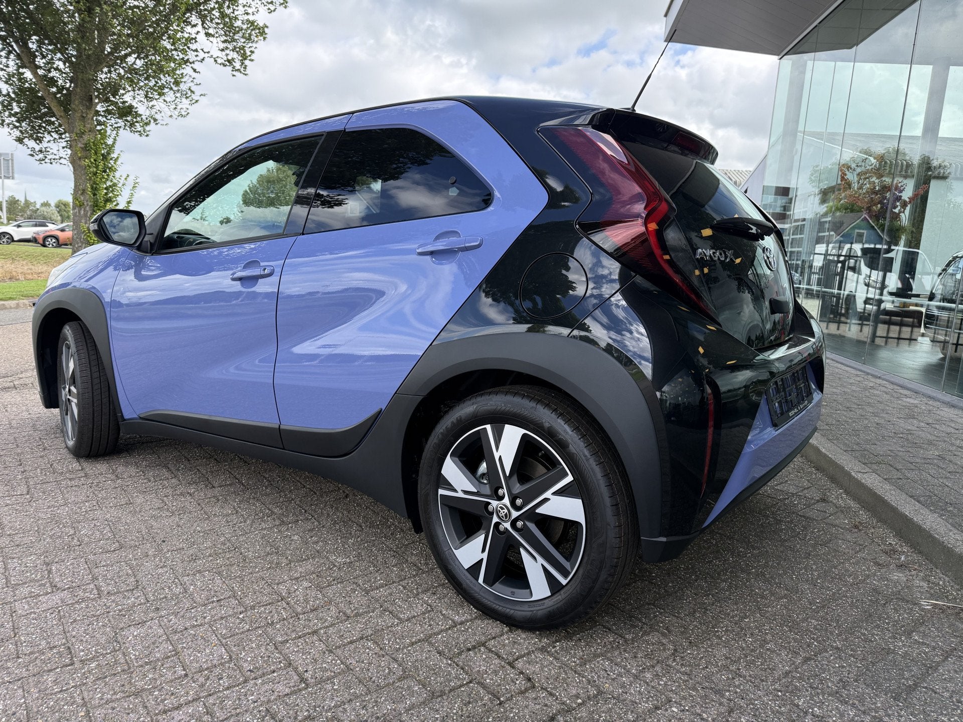 Toyota Aygo X Hybrid 115 pulse Automaat * Stoelverwarming *, Auto's, Stof, Gebruikt, Zwart, Overige kleuren